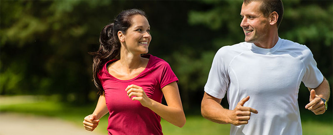 Couple jogging together to get healthy in San Diego