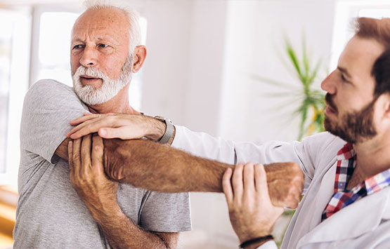 Patient getting a chiropractic shoulder adjustment at Center For Auto Accident Injury Treatment in San Diego